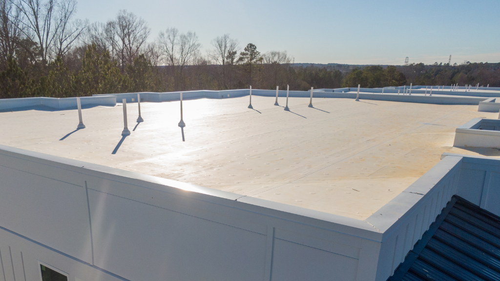 Weathering the Storm: How to Safeguard Your Commercial Property with Flat Roofing